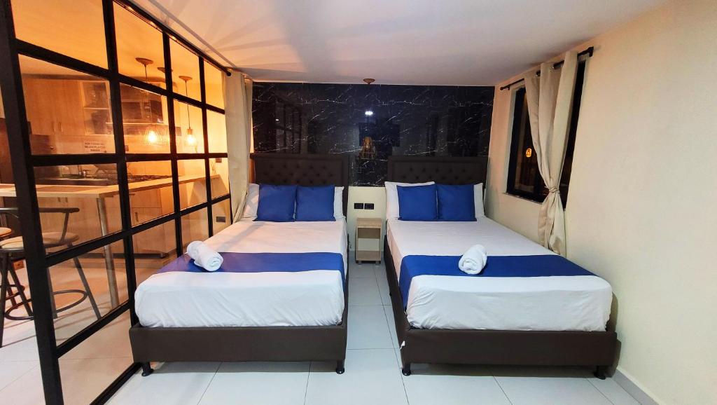 Katil atau katil-katil dalam bilik di Andaliving Campo Valdés Apartaestudio