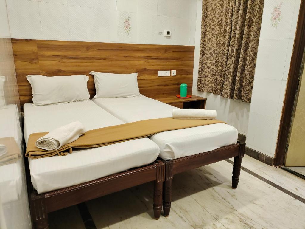 מיטה או מיטות בחדר ב-Nile Guest House