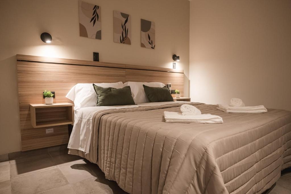 Postel nebo postele na pokoji v ubytování Hotel Libertad