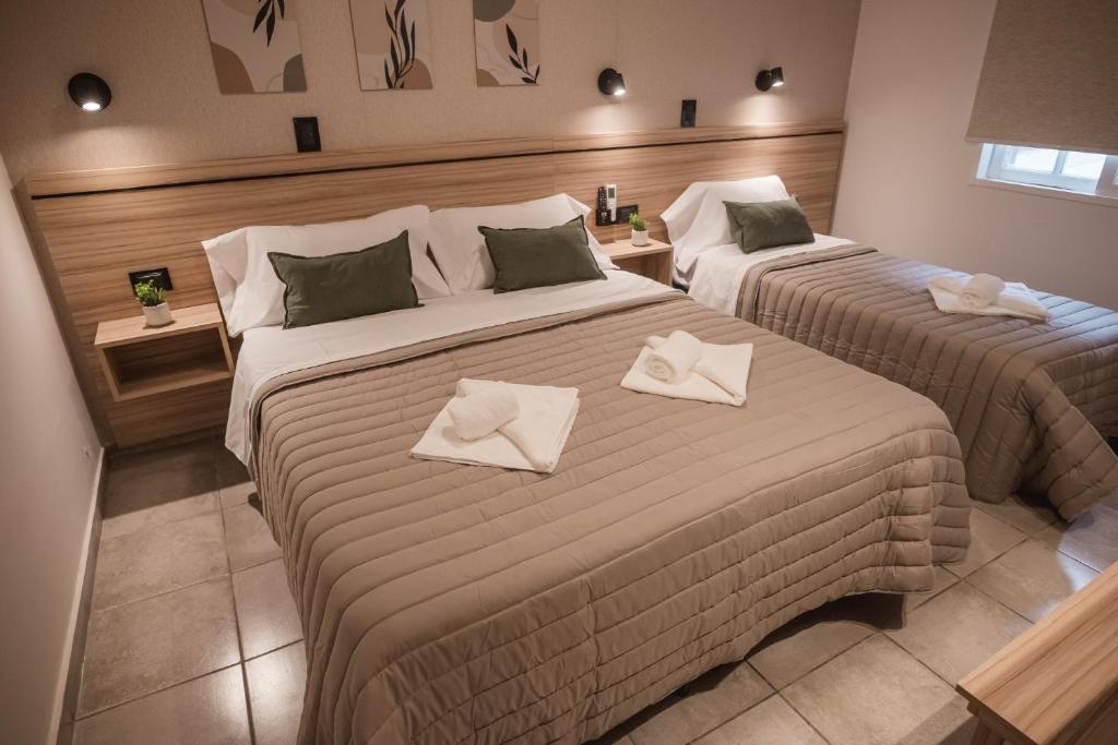 Postel nebo postele na pokoji v ubytování Hotel Libertad