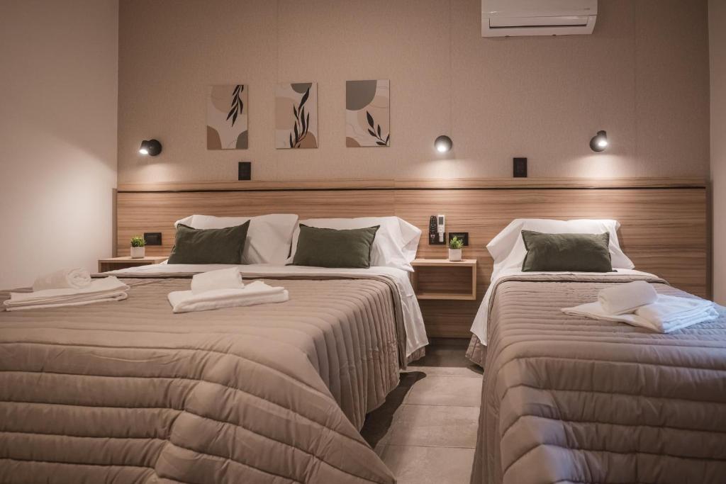 Postel nebo postele na pokoji v ubytování Hotel Libertad