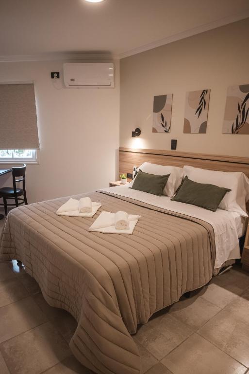 Postel nebo postele na pokoji v ubytování Hotel Libertad