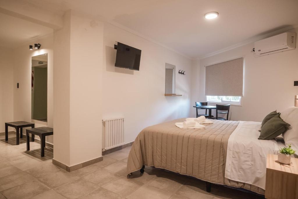 Postel nebo postele na pokoji v ubytování Hotel Libertad