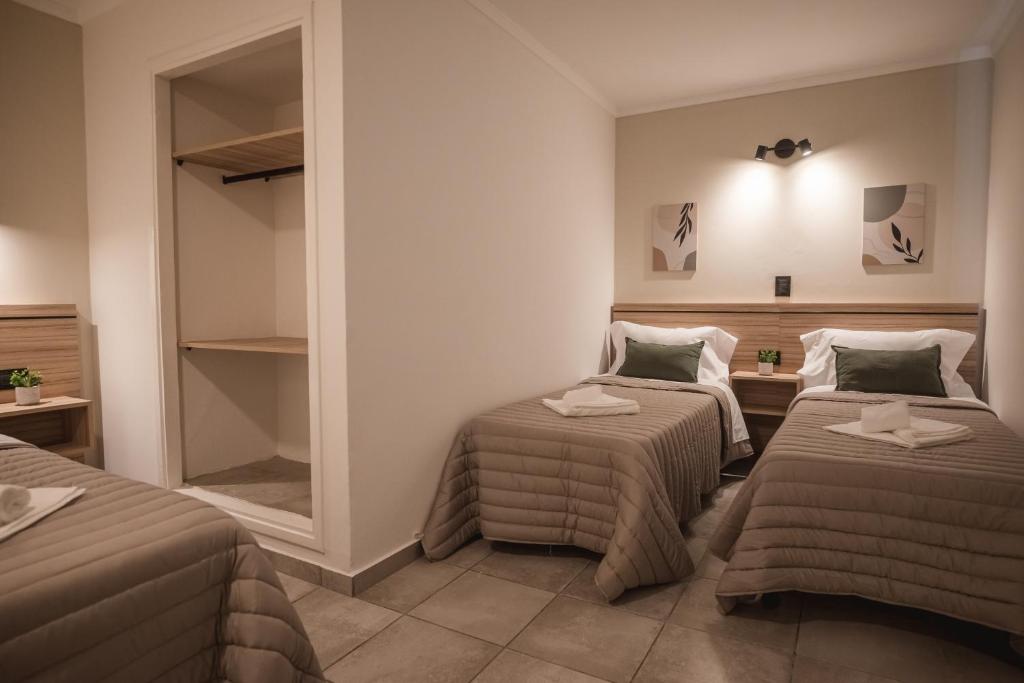 Postel nebo postele na pokoji v ubytování Hotel Libertad