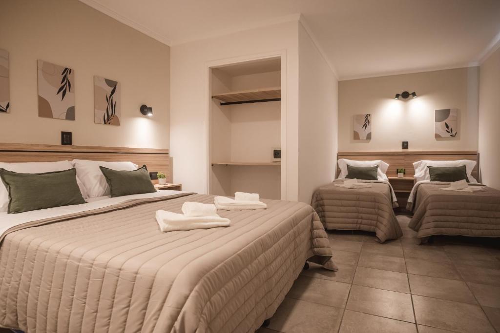 Postel nebo postele na pokoji v ubytování Hotel Libertad