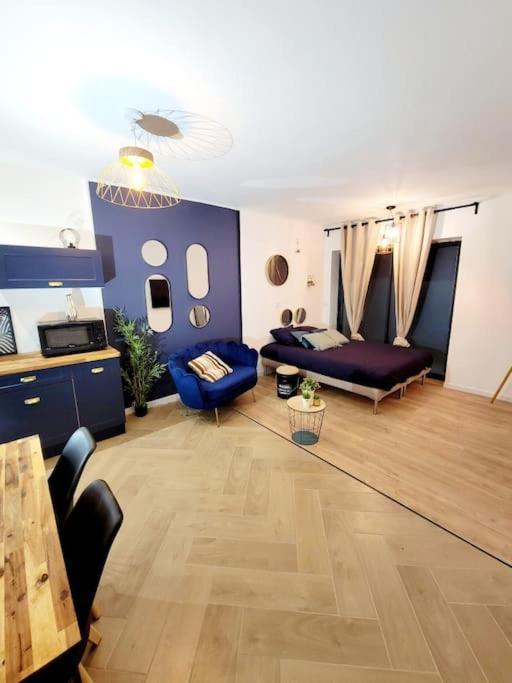 a living room with a couch and a table at le Very Cozy in Albi