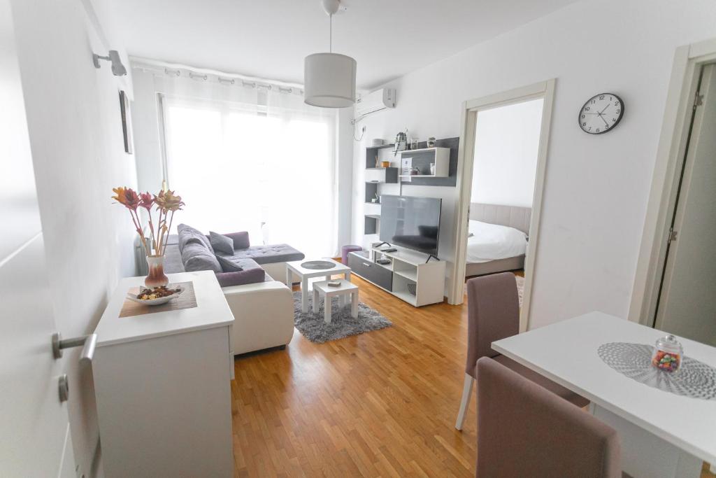 a living room with a couch and a table at ANAMARIE Apartment, free parking, Belgrade, Center, SRB in Vračar (historical)