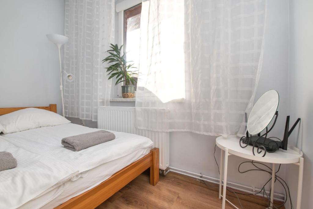 Apartament Modrzejewska tesisinde bir odada yatak veya yataklar