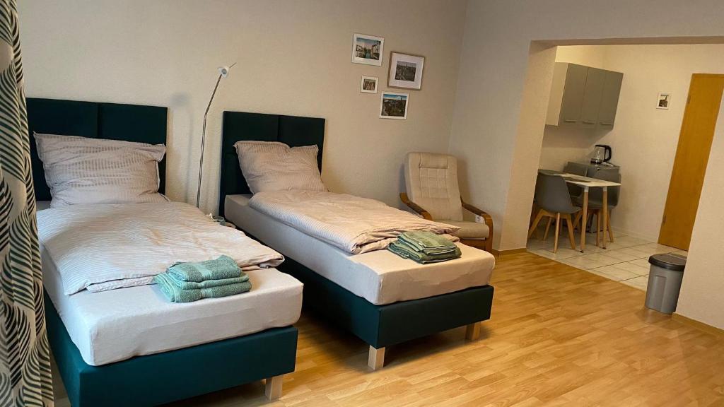 מיטה או מיטות בחדר ב-Pension Altsprucke