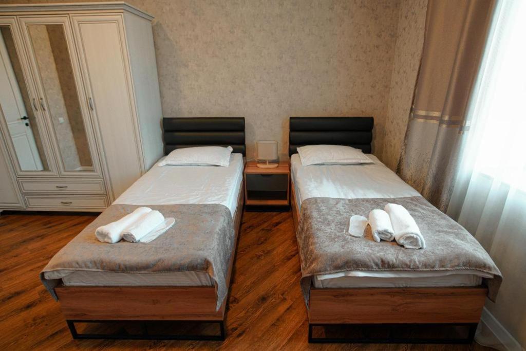 Postel nebo postele na pokoji v ubytování Lunisi Kvareli