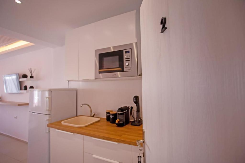 Kuchyň nebo kuchyňský kout v ubytování The Lavish Suite