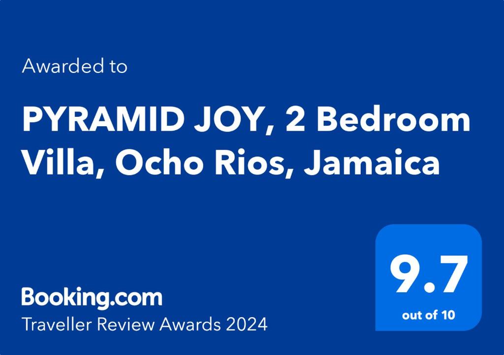 Una caja de texto azul con las palabras Pym Island Joy Villa dormitorio en PYRAMID JOY, 2 Bedroom Villa, Ocho Rios, Jamaica, en Ocho Ríos