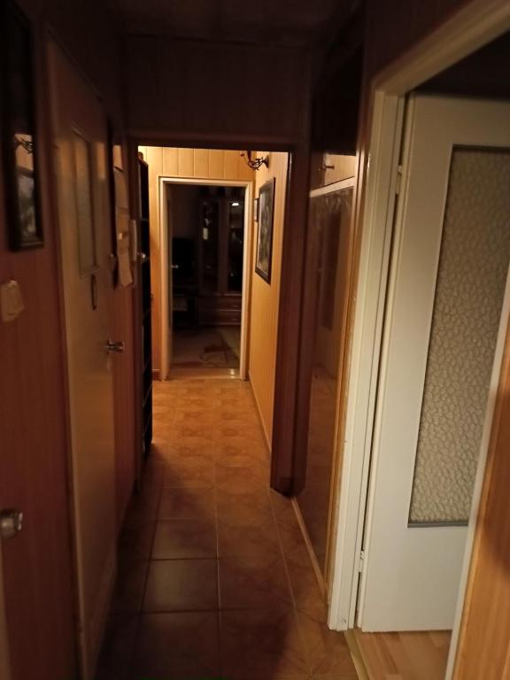 a hallway leading to a room with a hallway at Mieszkanie 2pokojowe in Wieliczka