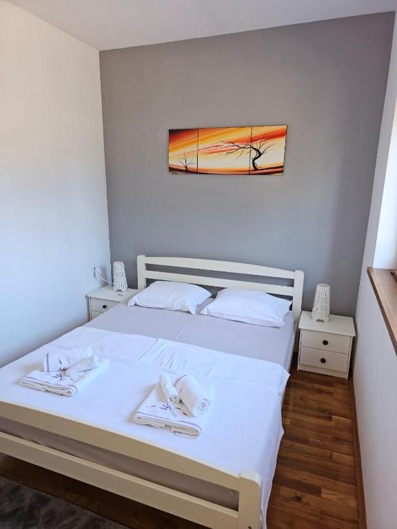 Postel nebo postele na pokoji v ubytování Apartman More