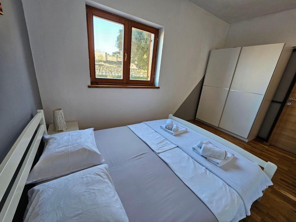 Postel nebo postele na pokoji v ubytování Apartman More