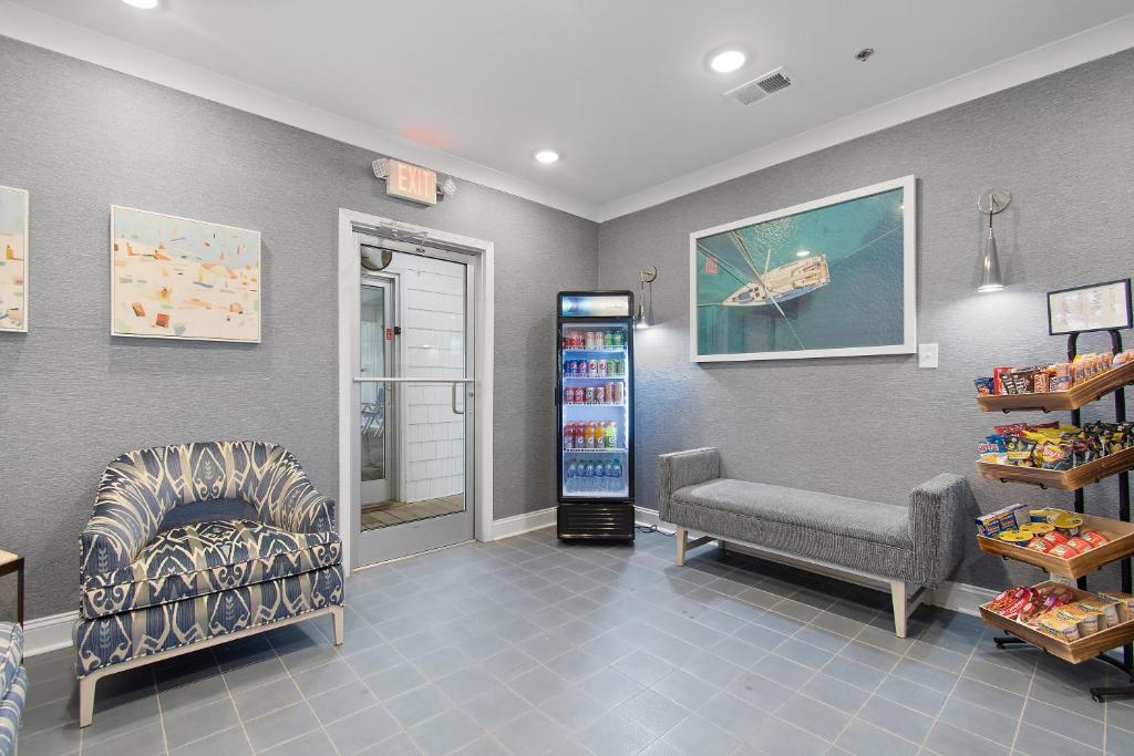 a waiting room with a couch and a chair in a store at Ocean Isle Inn in Ocean Isle Beach