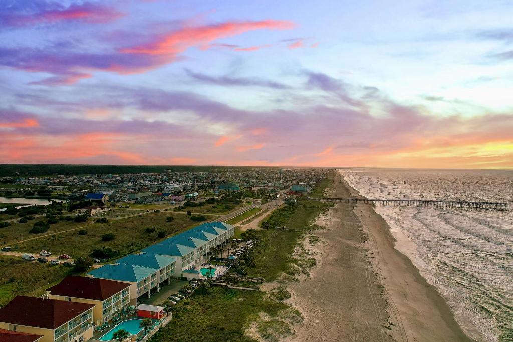 an aerial view of the beach and the ocean at Ocean Isle Inn in Ocean Isle Beach