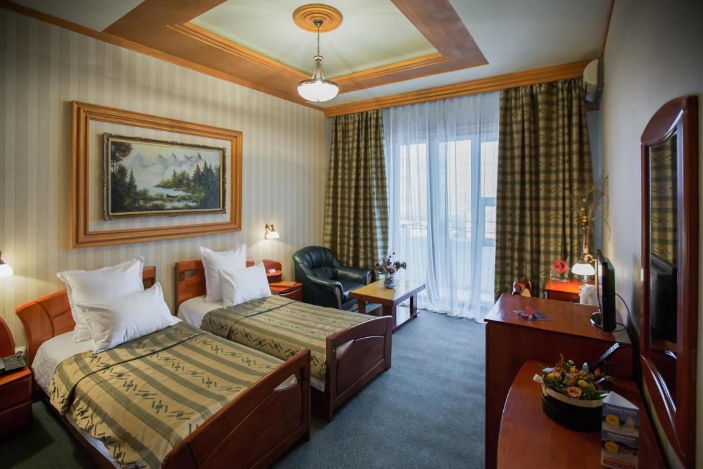 Postel nebo postele na pokoji v ubytování Bucharest Comfort Suites Hotel