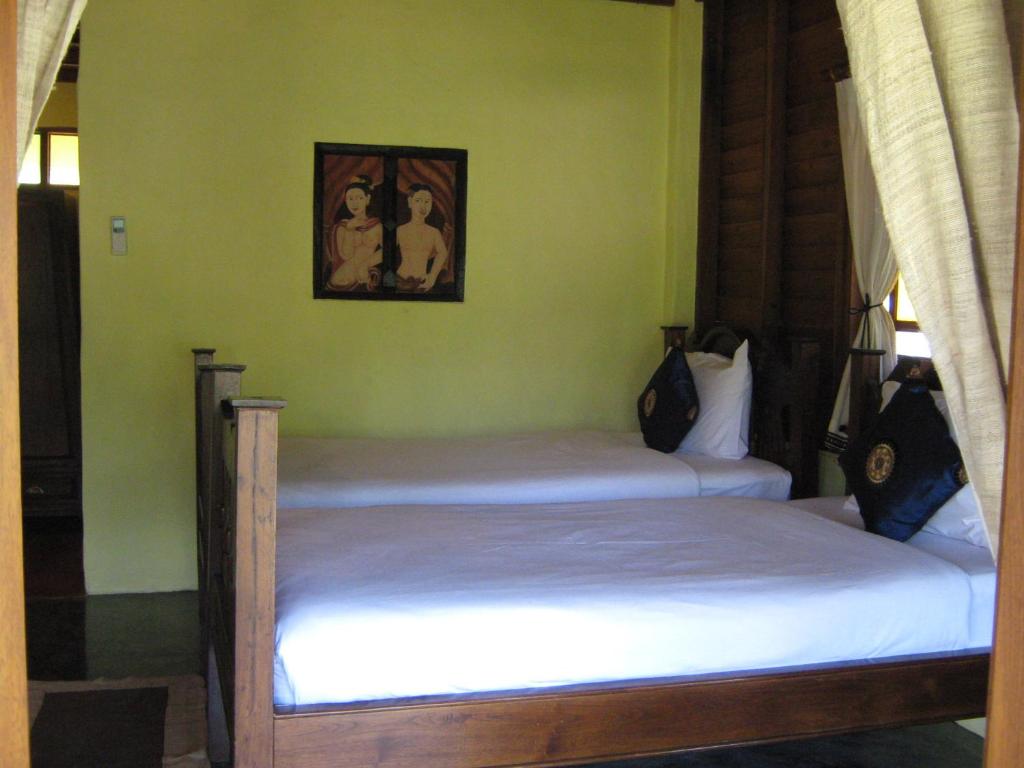 Postel nebo postele na pokoji v ubytování Pai Vimaan Resort