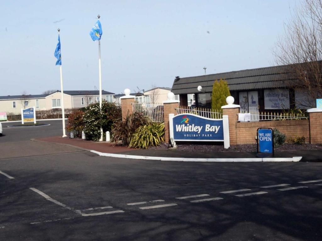 a building with a sign for a whittlebury bay at Let's Caravan at Whitley Bay in Whitley Bay