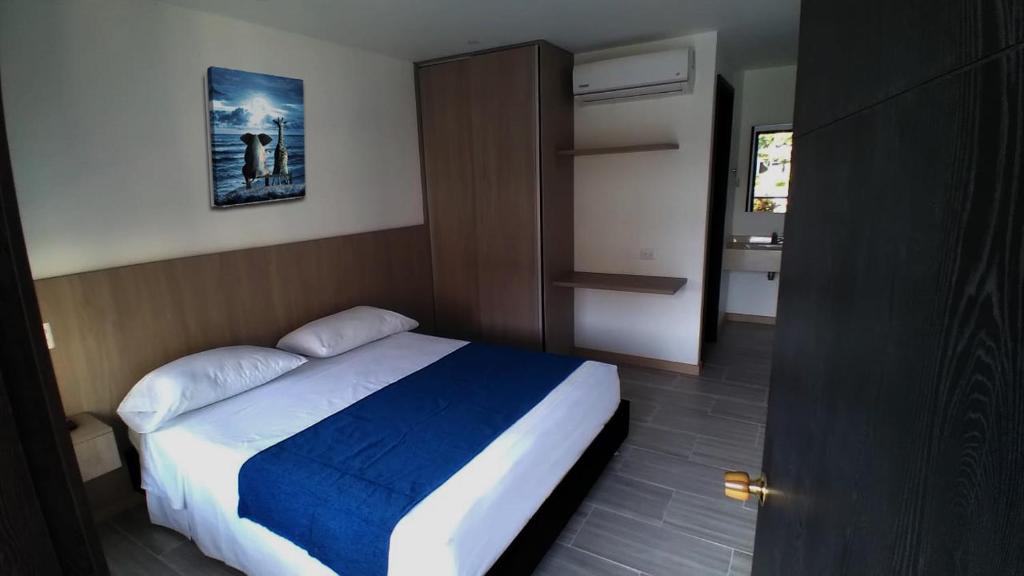 Una cama o camas en una habitación de Hotel Las Victorias Palmira