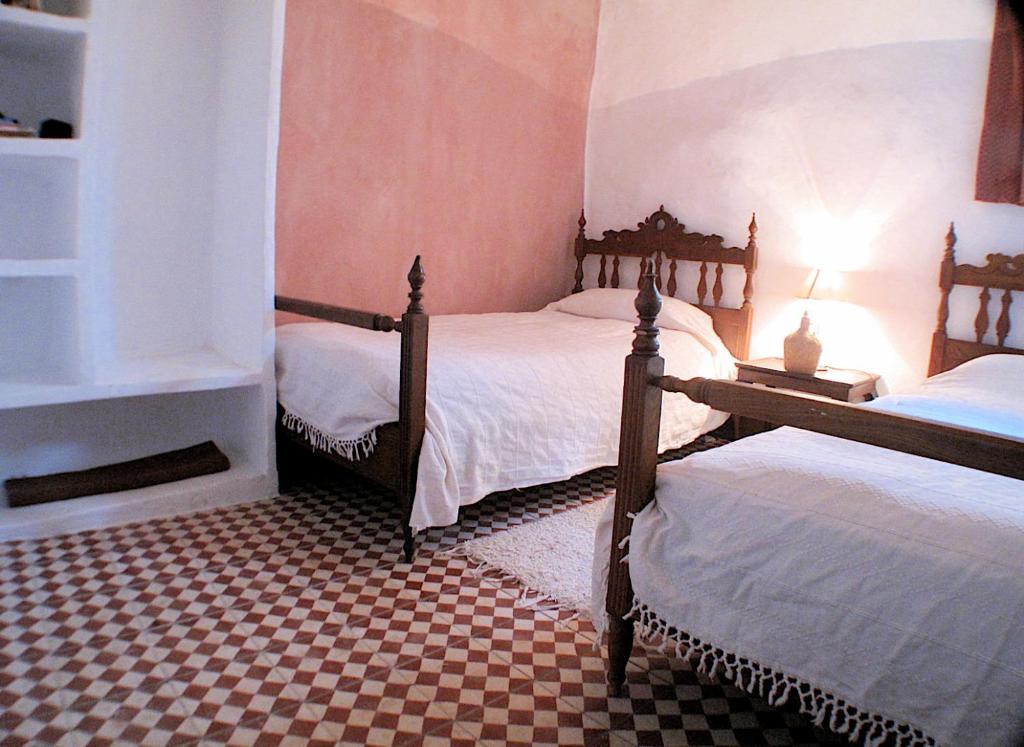 Posteľ alebo postele v izbe v ubytovaní Rural House, heated pool & steam room, Casa Aloe.