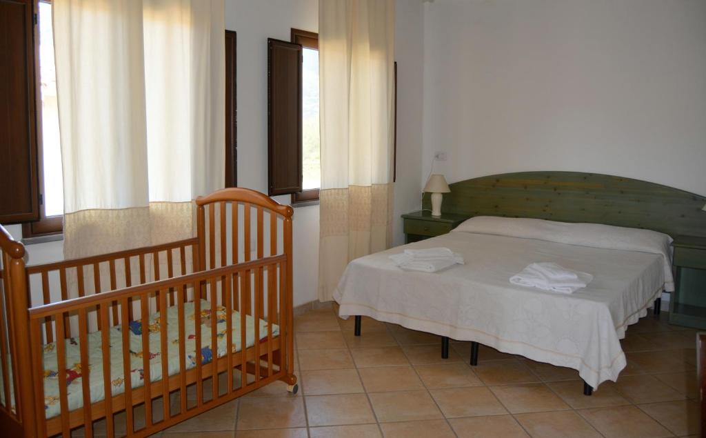 Postel nebo postele na pokoji v ubytování Agriturismo Rubinu
