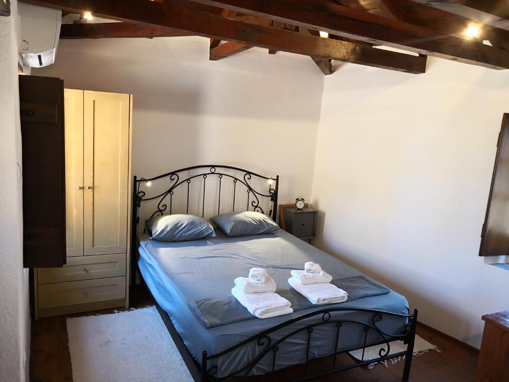 Postel nebo postele na pokoji v ubytování Kissamitakis Guesthouse