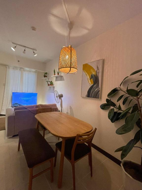 a living room with a table and a couch at 2BEDROOM Condo for rent in Quezon City in Manila