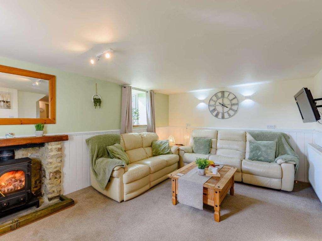 a living room with a couch and a fireplace at 3 Bed in Pickering 88958 in Newton