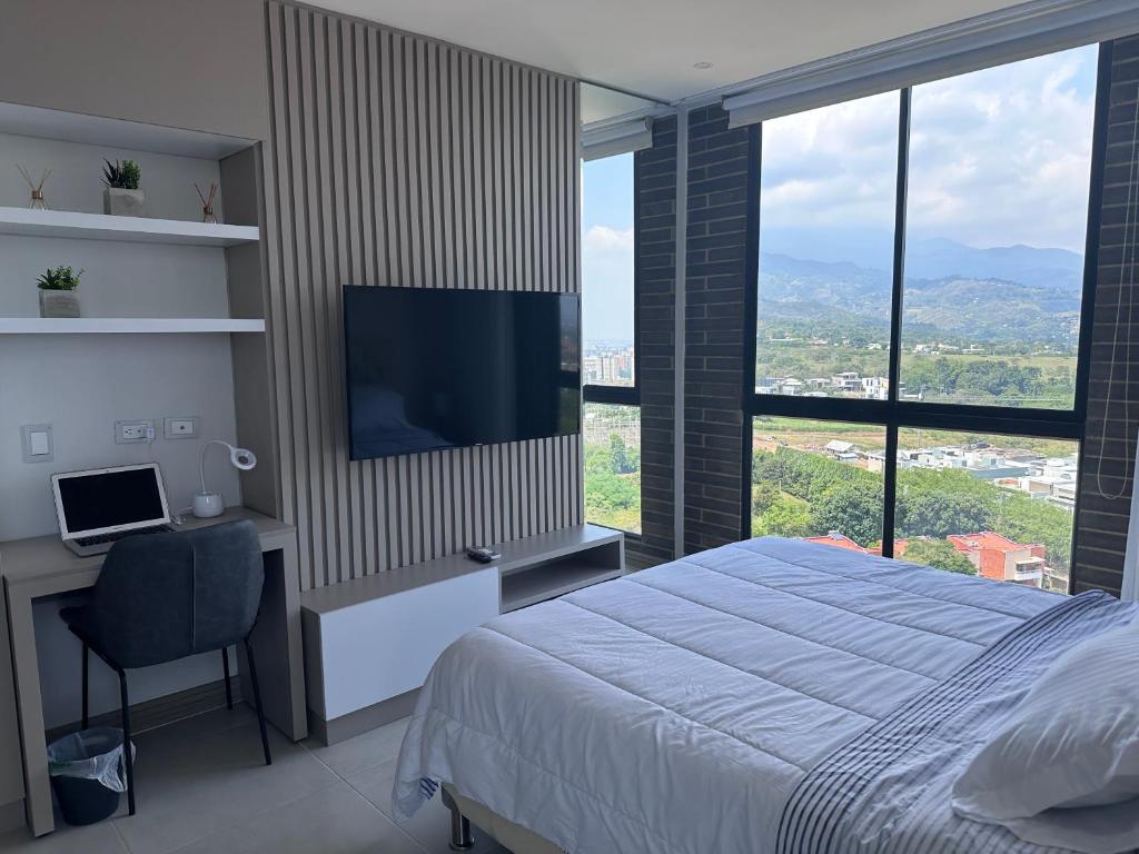 Μια τηλεόραση ή/και κέντρο ψυχαγωγίας στο Luxury Studio Con Vista Pance