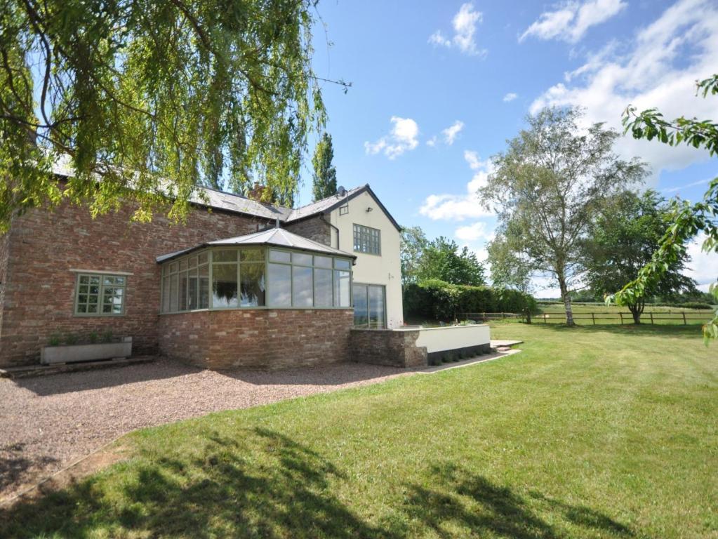 a house with a large lawn in front of it at 3 Bed in Ross-on-Wye 75491 in Llangarren