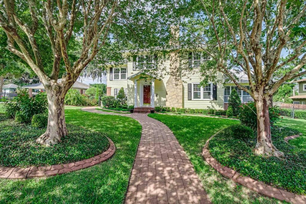 a house with trees and a brick walkway at Beautiful 5BR/4BA Luxury Historic Home on Success in Lakeland