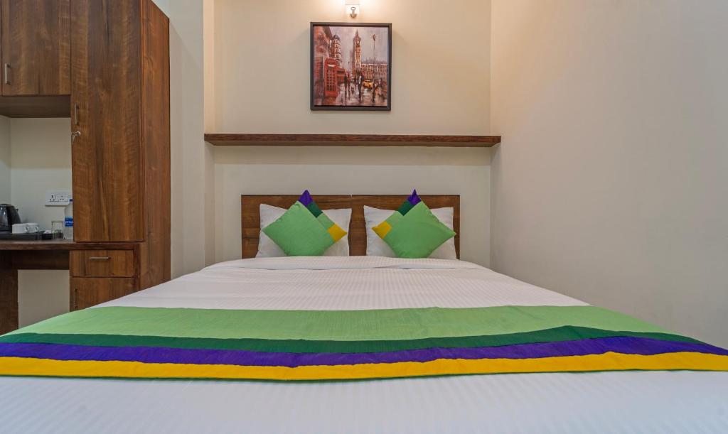 Postel nebo postele na pokoji v ubytování Itsy Hotels Avani Stays, Vyttila, Kochi