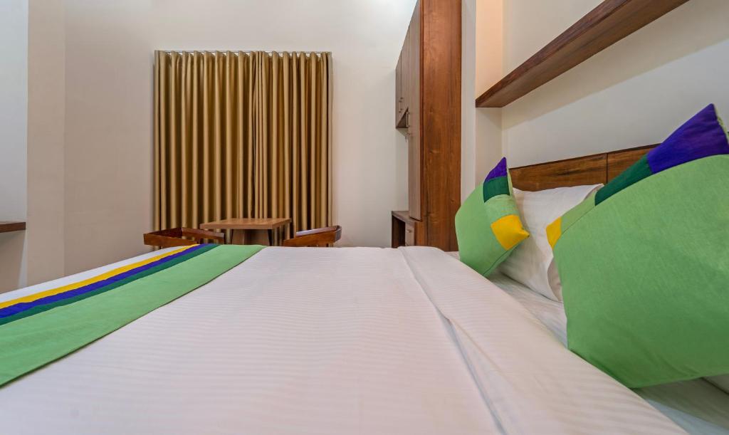 Postel nebo postele na pokoji v ubytování Itsy Hotels Avani Stays, Vyttila, Kochi
