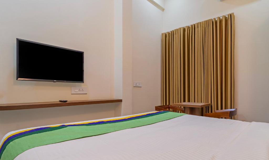 TV a/nebo společenská místnost v ubytování Itsy Hotels Avani Stays, Vyttila, Kochi
