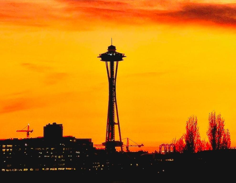 a control tower in front of a sunset at The Queen of Eastlake in Seattle