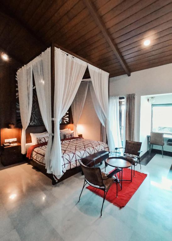 Postel nebo postele na pokoji v ubytování Anamiva, Goa - AM Hotel Kollection