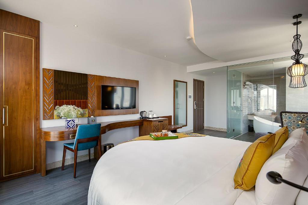 Postel nebo postele na pokoji v ubytování TGT BEACH HOTEL