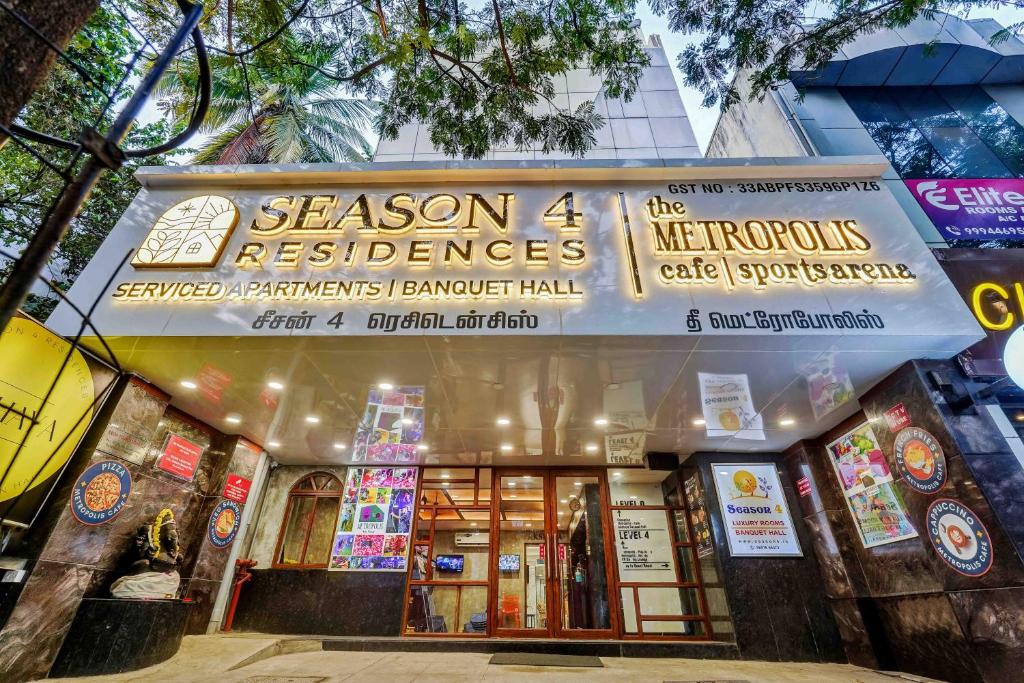 a building with a sign that reads season excellence at Season 4 Residences - Teynampet Near Apollo Hospital ,Balaji Dental, US Consulate in Chennai