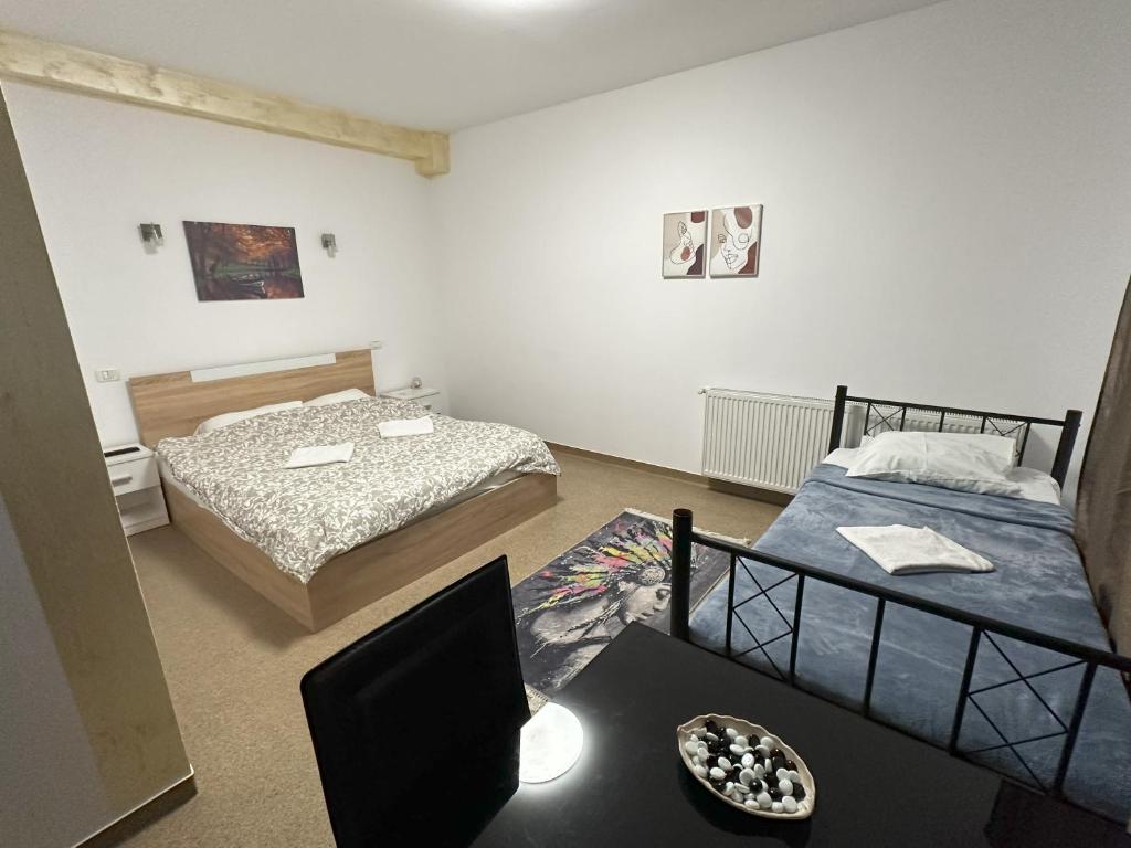 Postel nebo postele na pokoji v ubytování Hotel ENZO