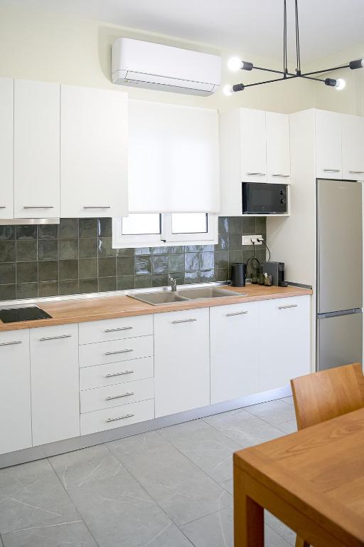 Kuchyň nebo kuchyňský kout v ubytování INOHO Fern Apartment