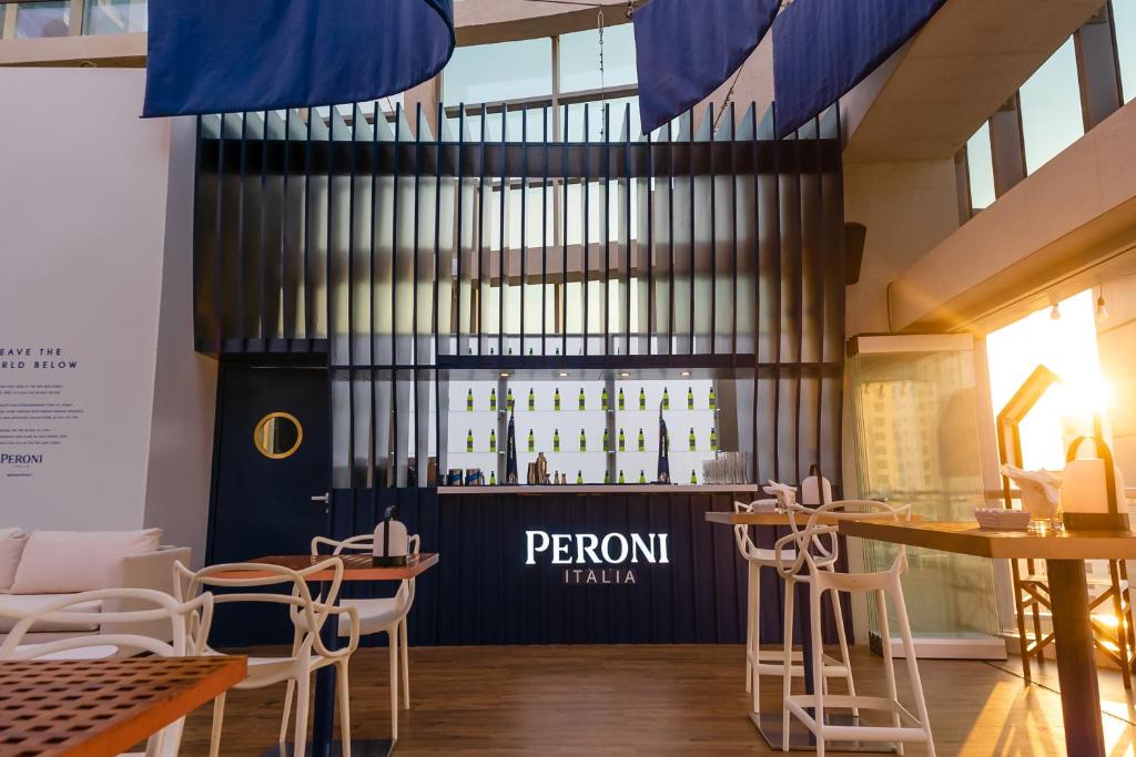 a restaurant with tables and chairs and a sign that reads perronital at InterContinental Dubai Marina by IHG in Dubai