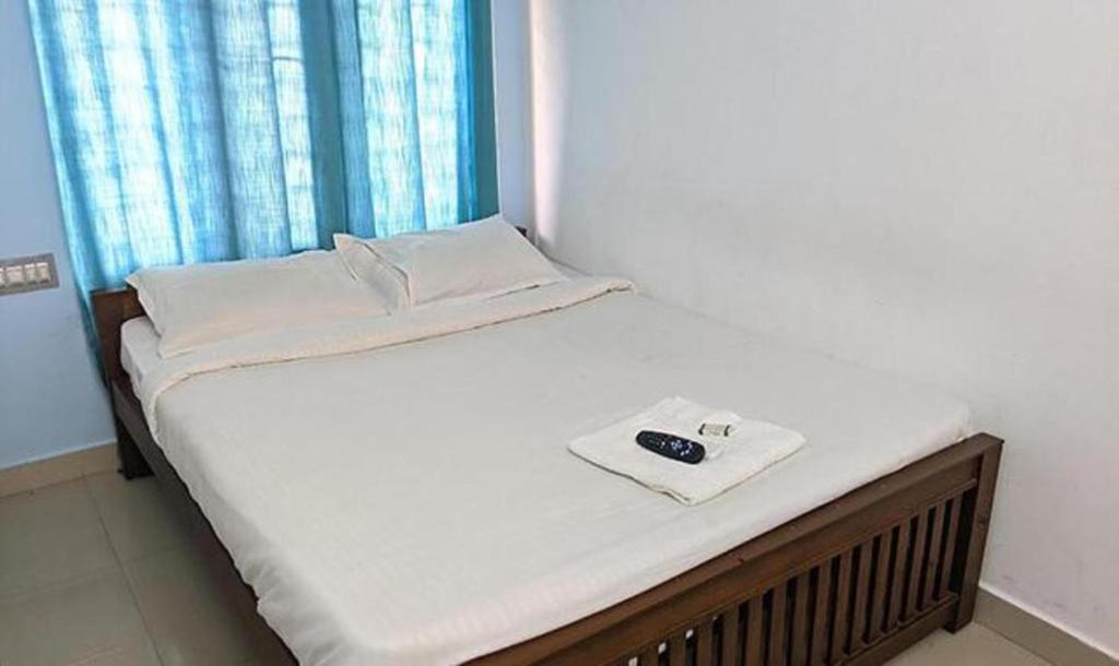 מיטה או מיטות בחדר ב-FabExpress Aabriz Residency
