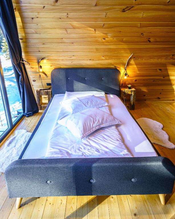 Postel nebo postele na pokoji v ubytování Black Chalet