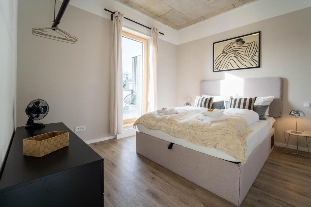 Postel nebo postele na pokoji v ubytování dreamcation Apartments Boardinghouse - Straubing Süd