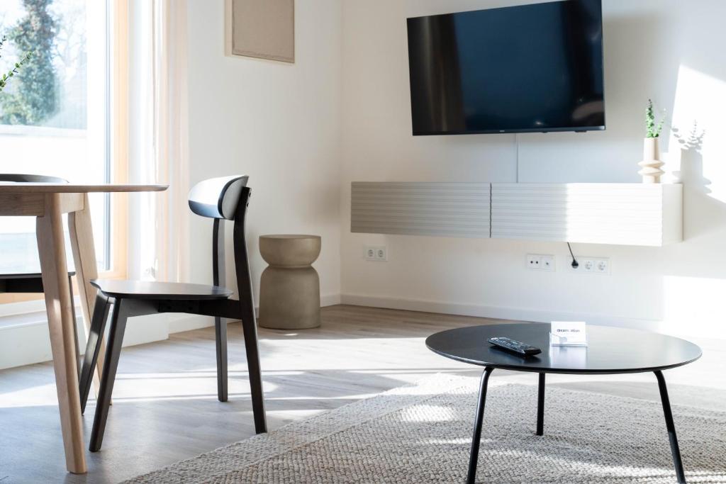 TV a/nebo společenská místnost v ubytování dreamcation Apartments Boardinghouse - Straubing Süd