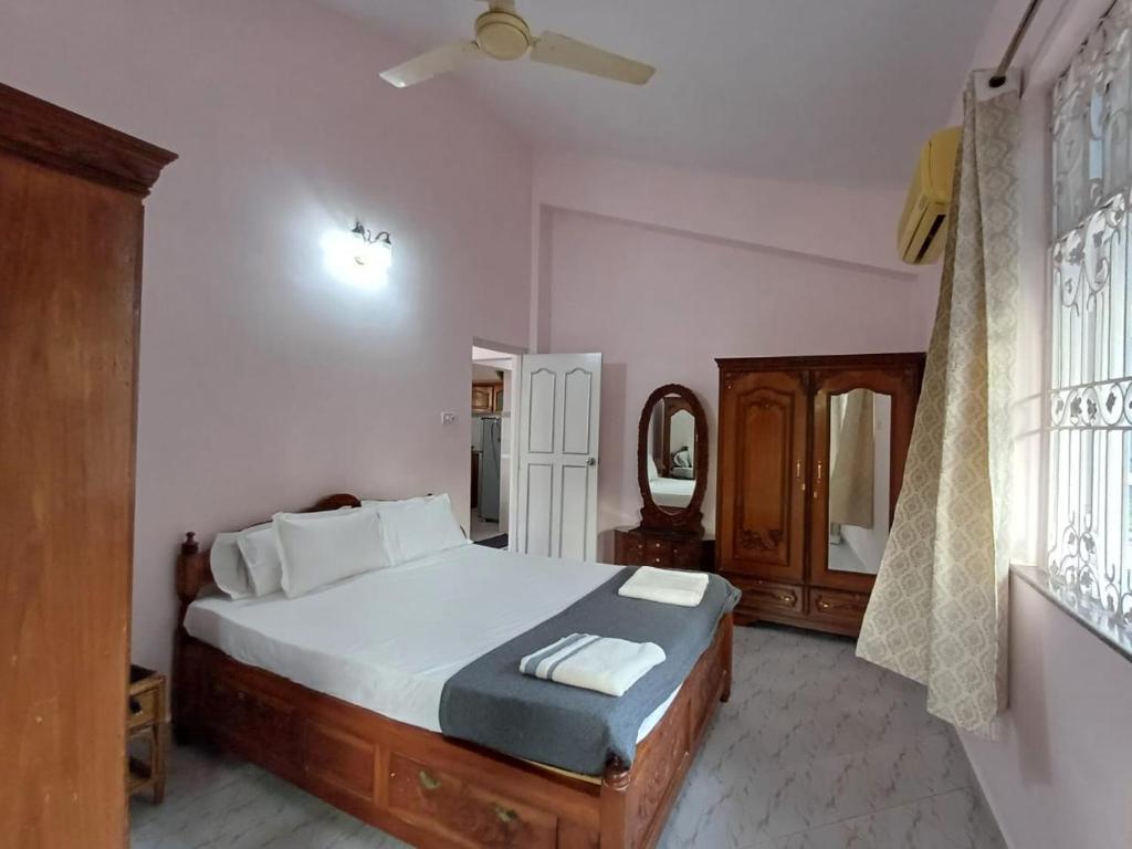 Postel nebo postele na pokoji v ubytování Kinara 2 bhk Villa