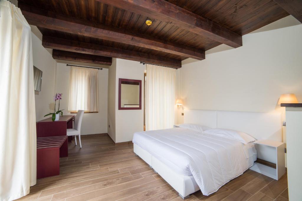 Postel nebo postele na pokoji v ubytování Il Borgo Ospitale - Albergo Diffuso