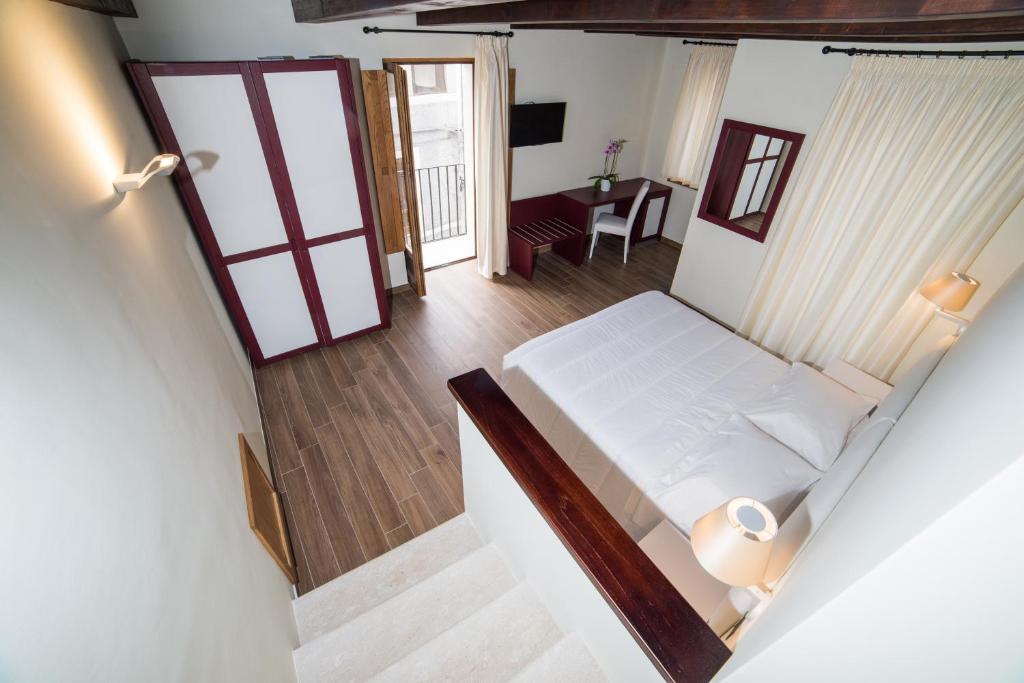 Postel nebo postele na pokoji v ubytování Il Borgo Ospitale - Albergo Diffuso